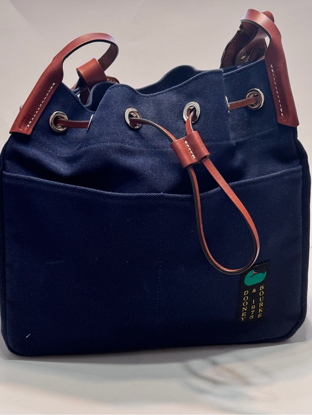 Dooney & Bourke Navy Canvas Drawstring Tote with Brown Leather Trim